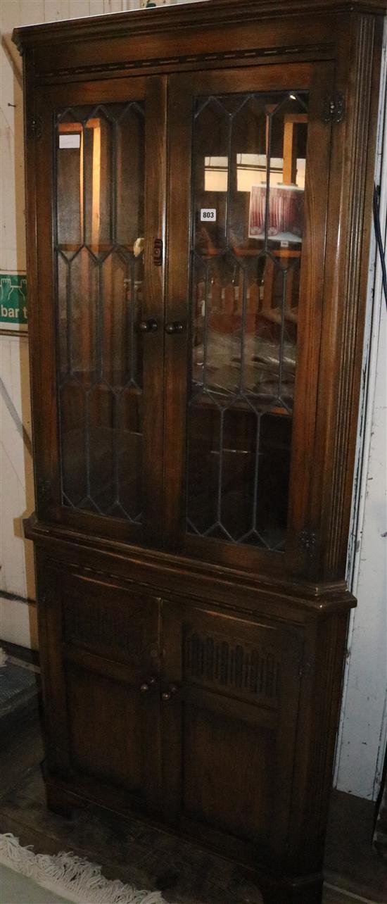 Carved oak standing corner cupboard